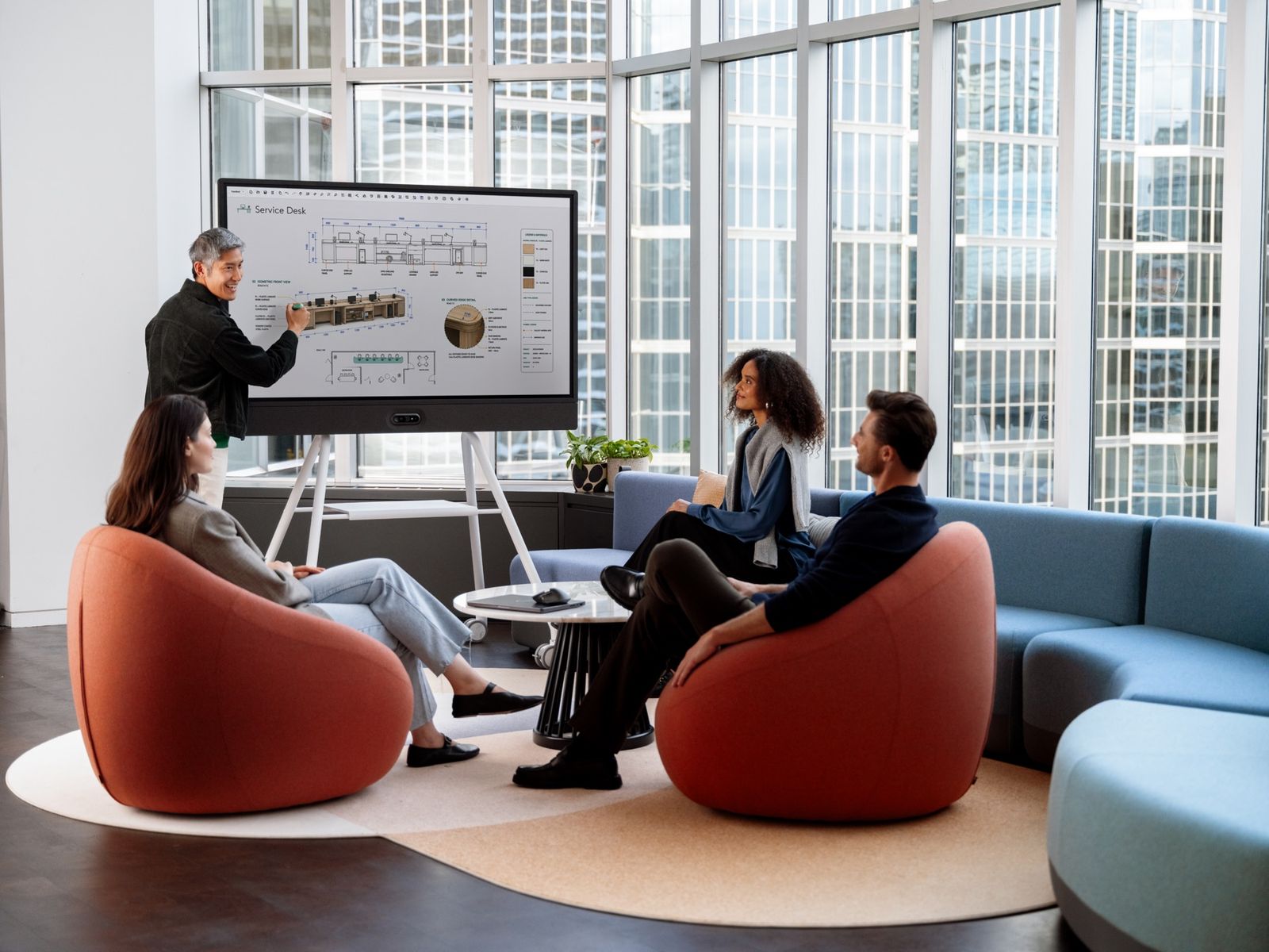 People collaborating in a modern office lounge